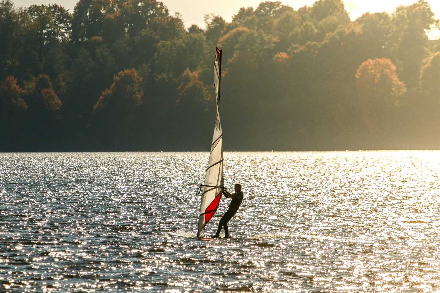 A windsurfer on a lake