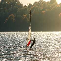 A windsurfer on a lake