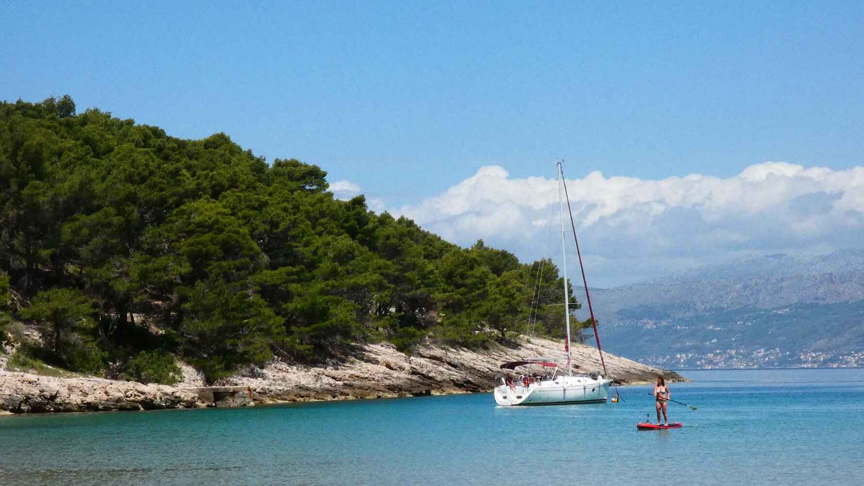 Paddleboarding next to a sailing boat near the island of Brac 