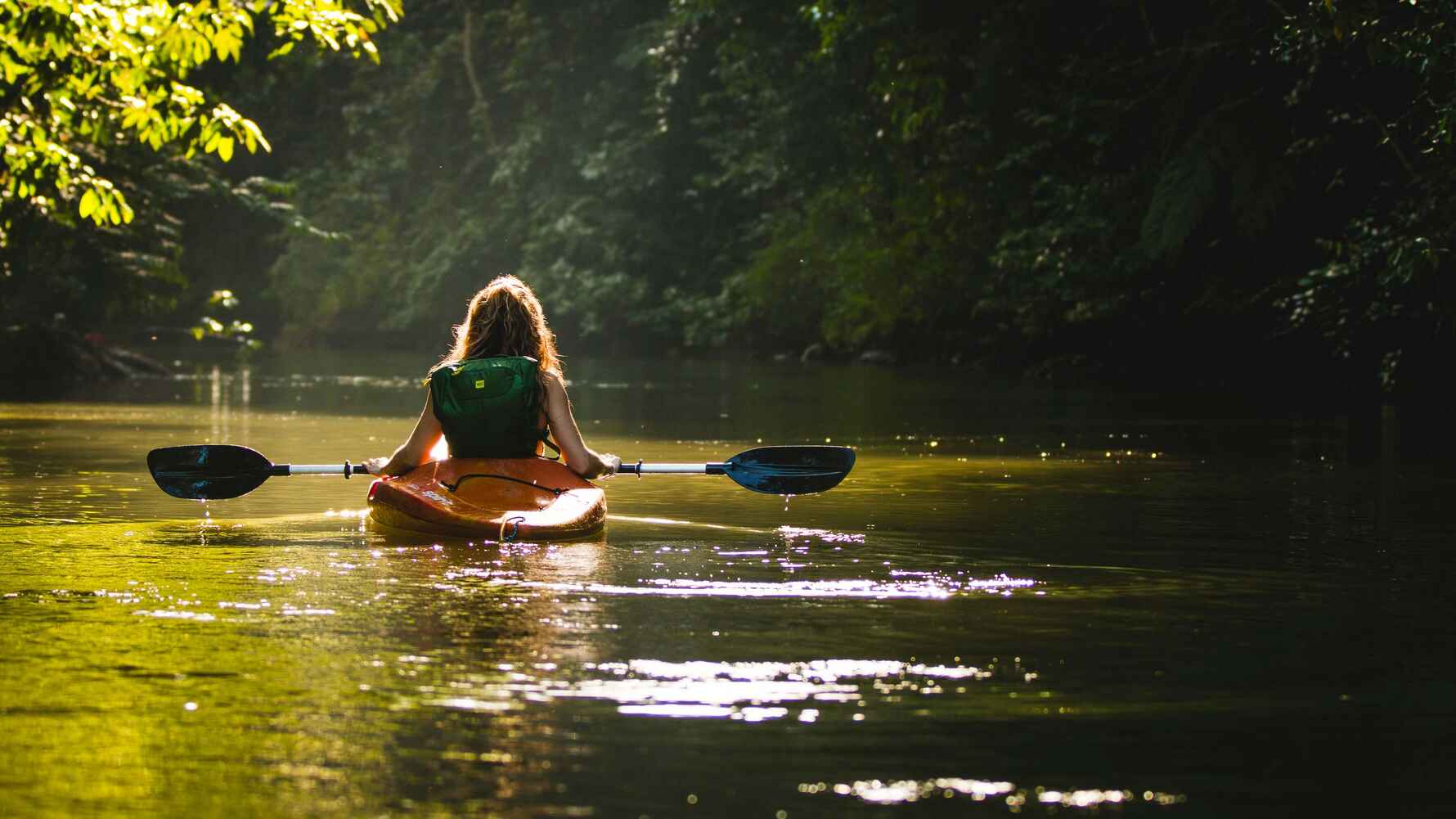 Person kayaking in a river in Costa Rica
