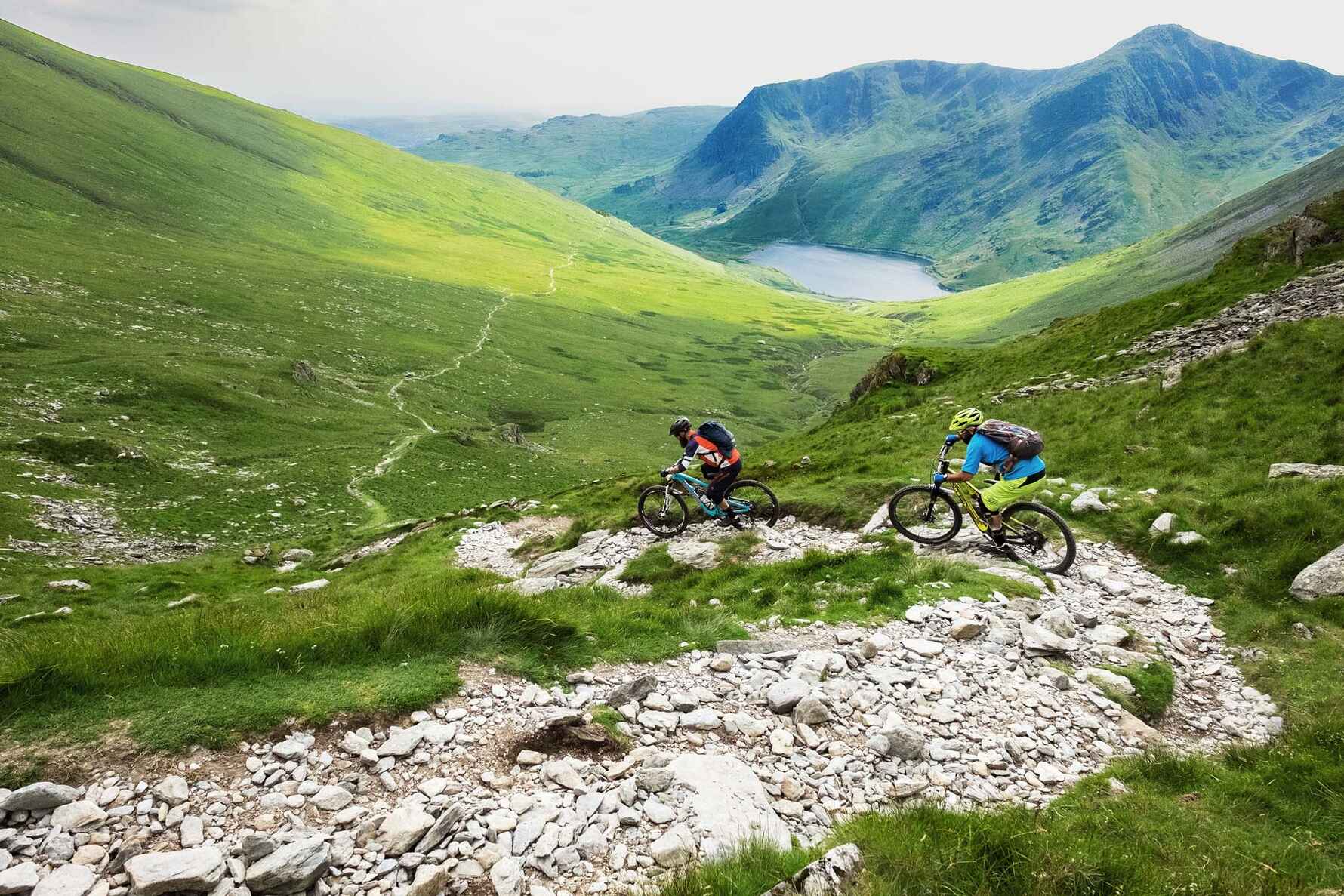 Two people mountain biking in the Lake District