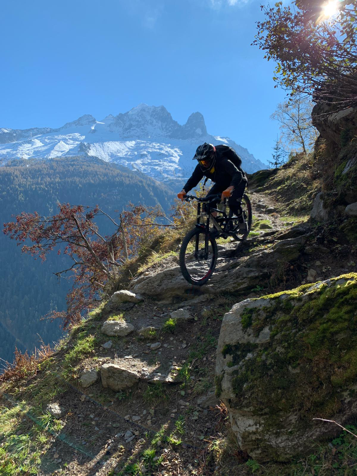 image showing mountain biker riding down a mountain