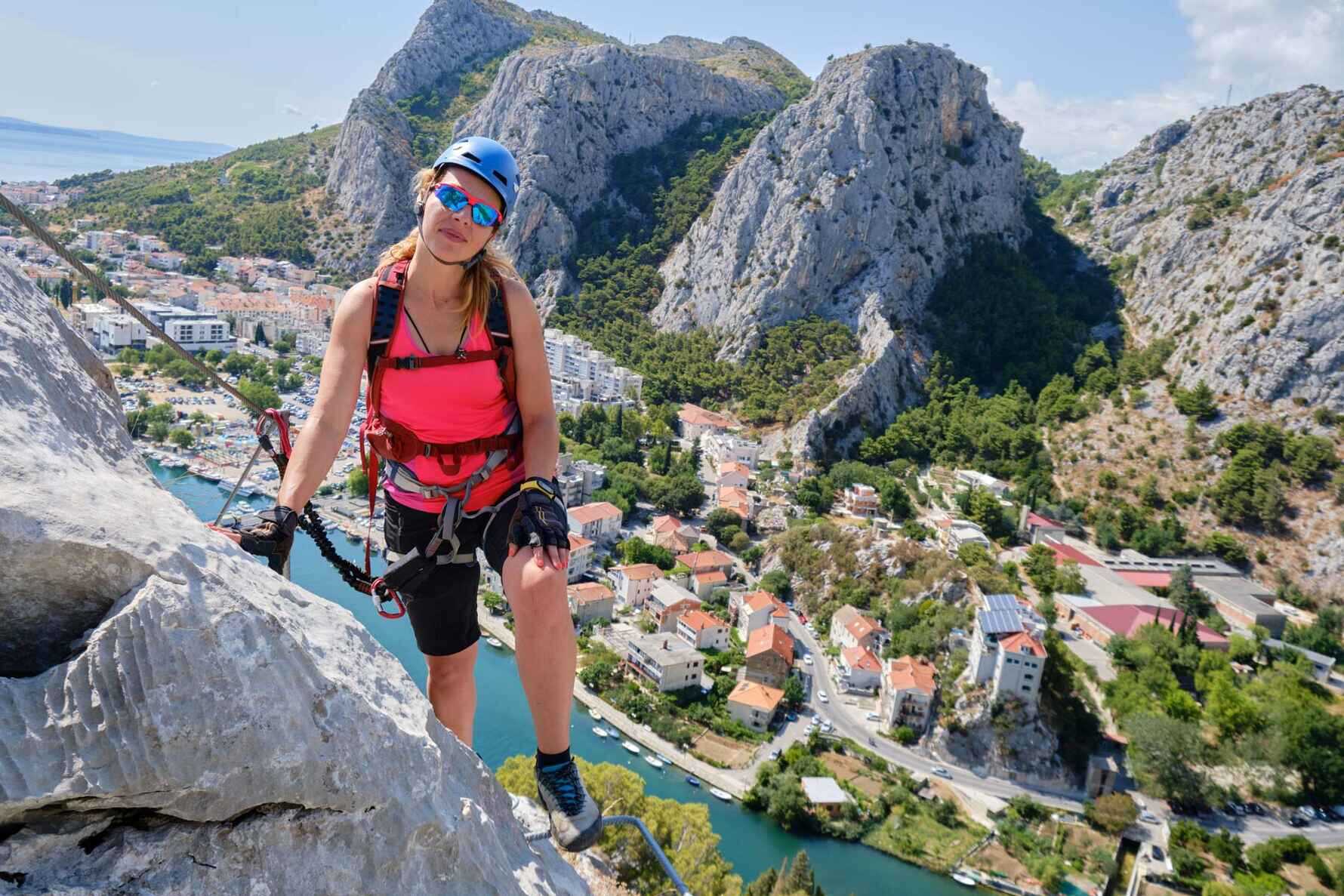 A lady rock climbing in Omis, Croatia